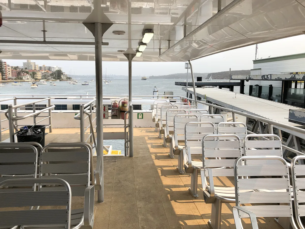 a row of wooden benches sitting on top of a chair