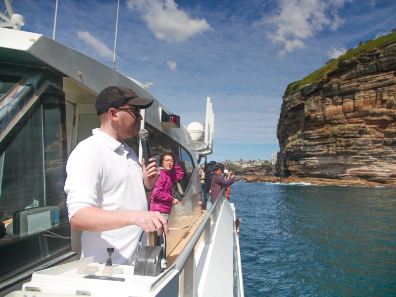 a man standing on a boat in the water