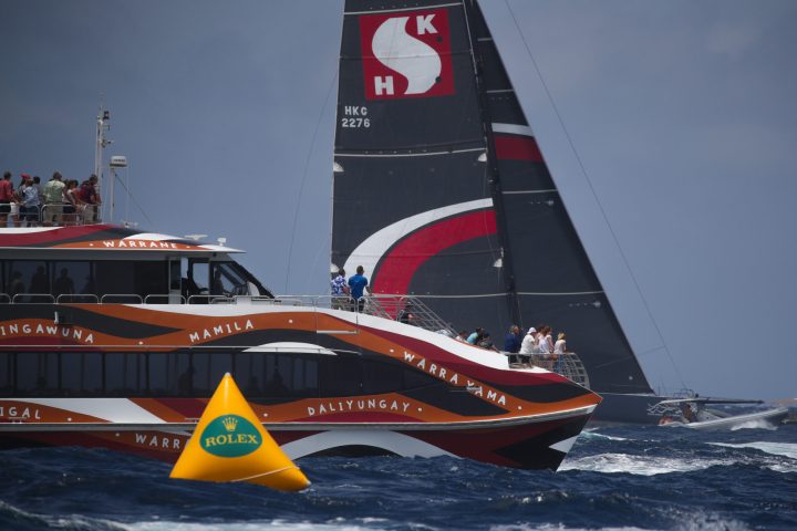 an orange boat on a body of water