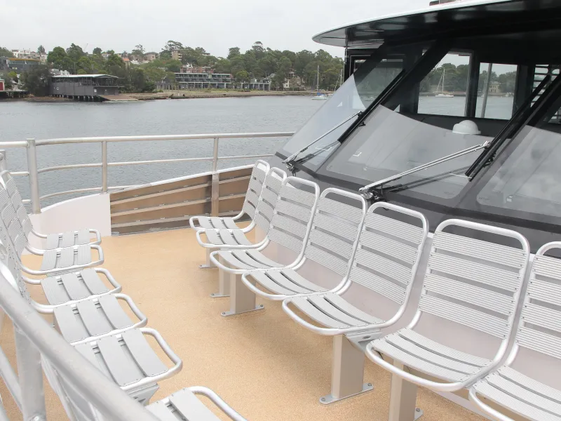 a boat sitting on top of a metal fence