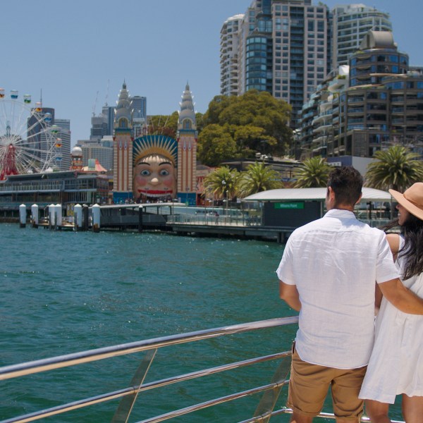 a person standing next to a body of water