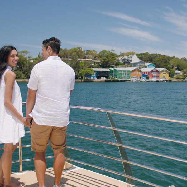 a person standing next to a body of water