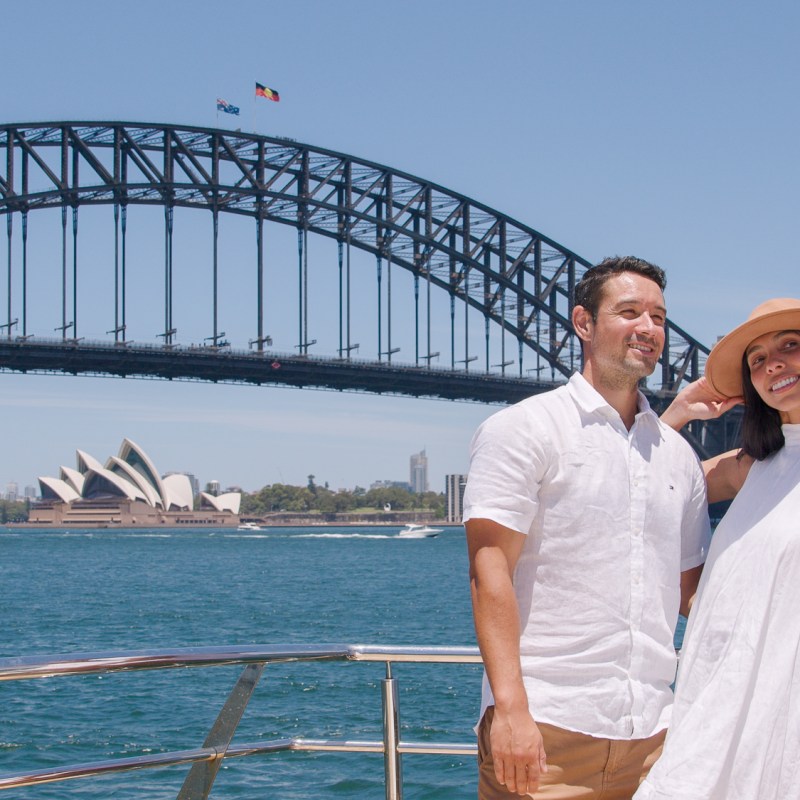 a man standing on a bridge over a body of water