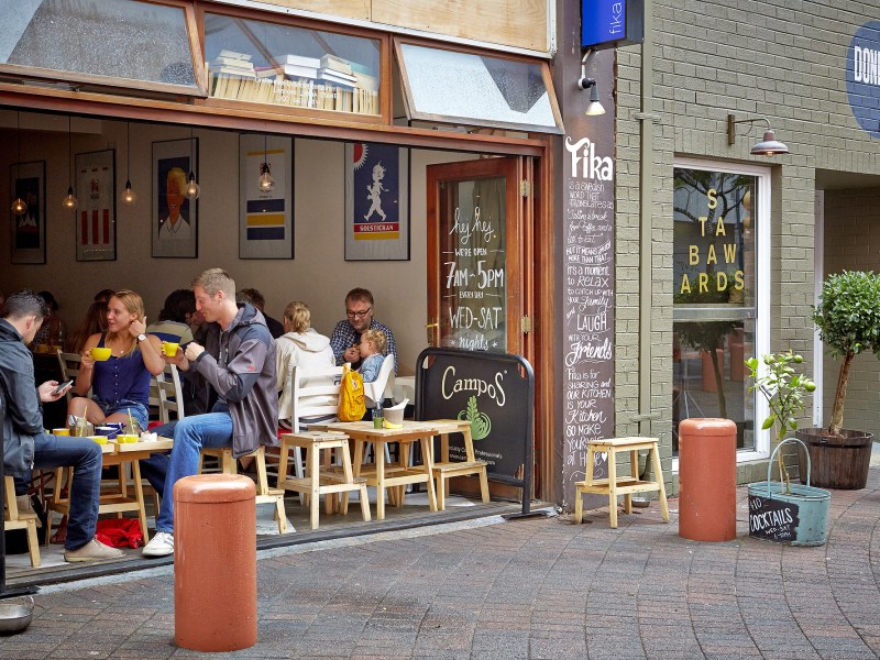 a group of people standing in front of a building