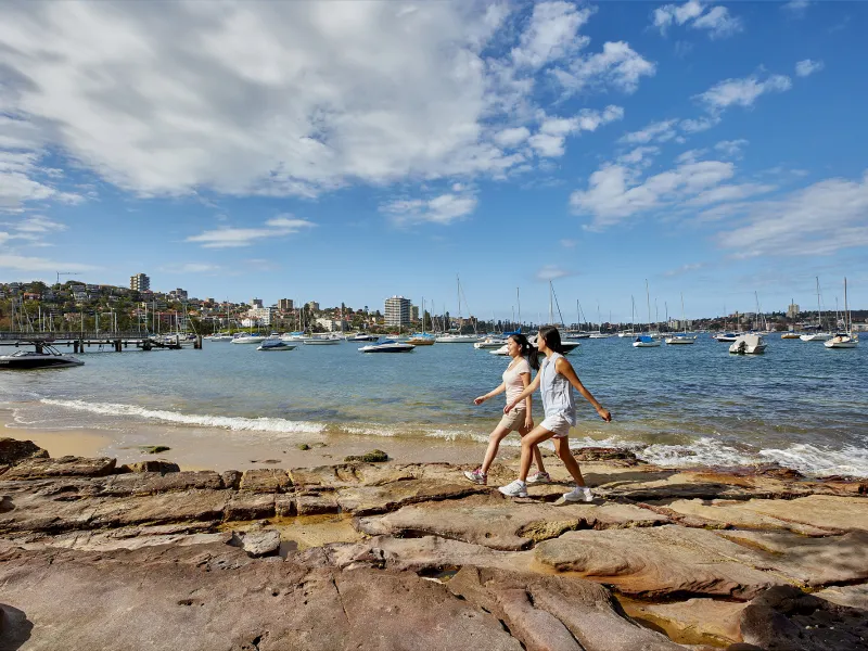 a man standing on top of a sandy beach