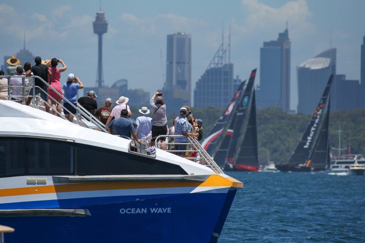 a group of people on a boat in a large body of water