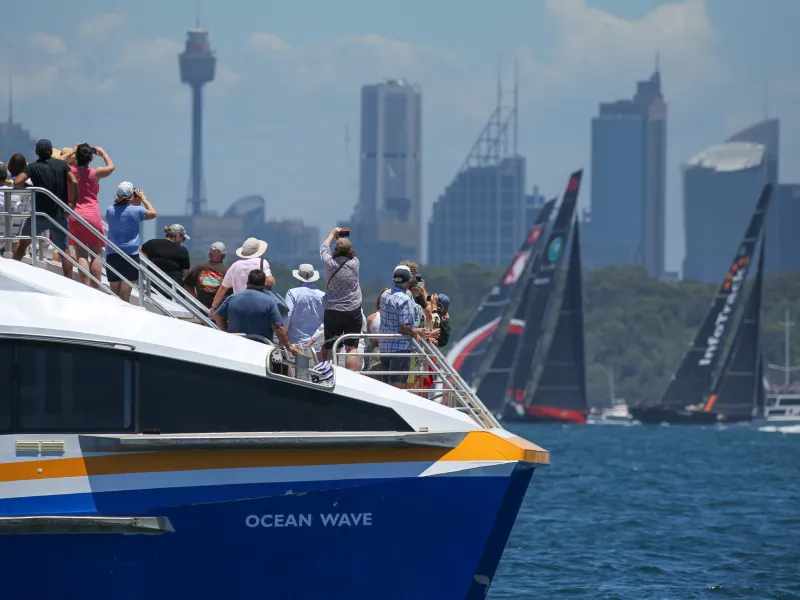 a group of people on a boat in a large body of water