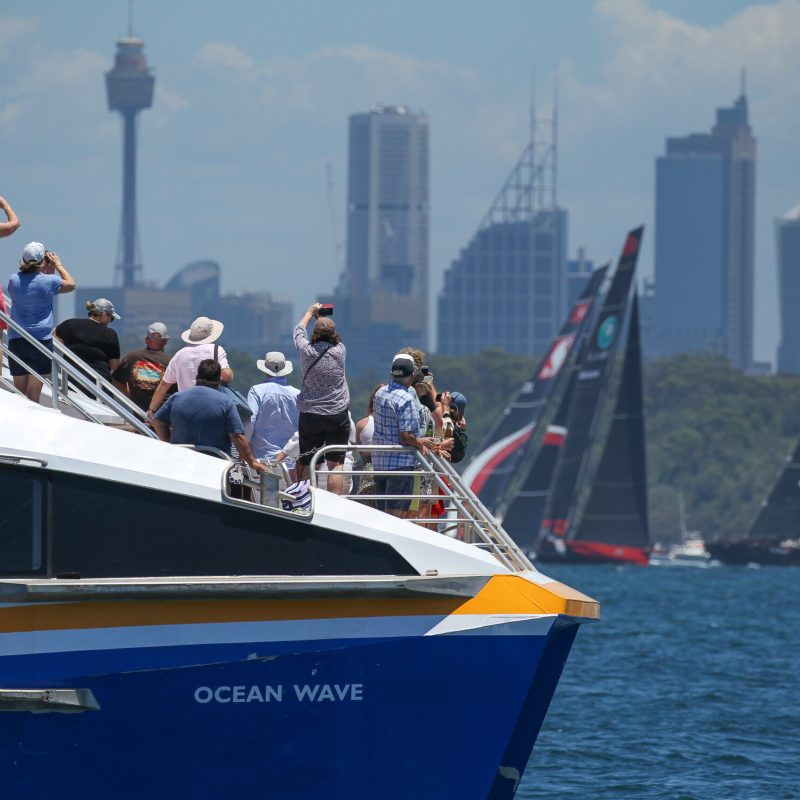 a group of people on a boat in a large body of water