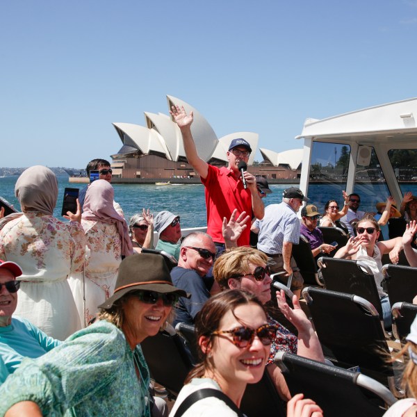 a group of people standing in front of a crowd