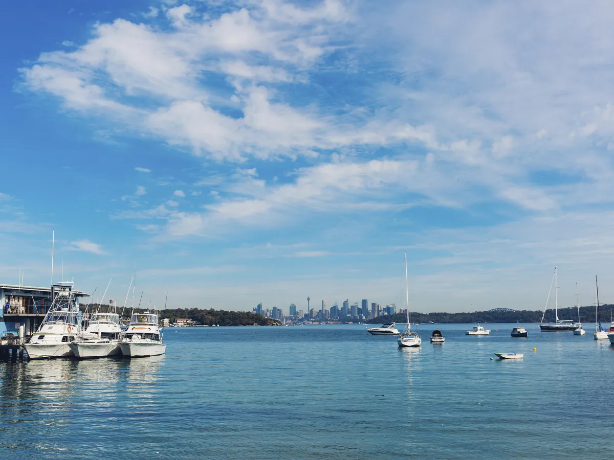 a boat is docked next to a body of water