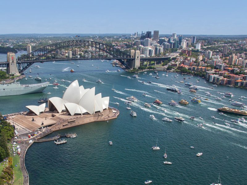 a large body of water with a city in the background