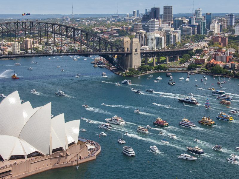 a large body of water with a city in the background
