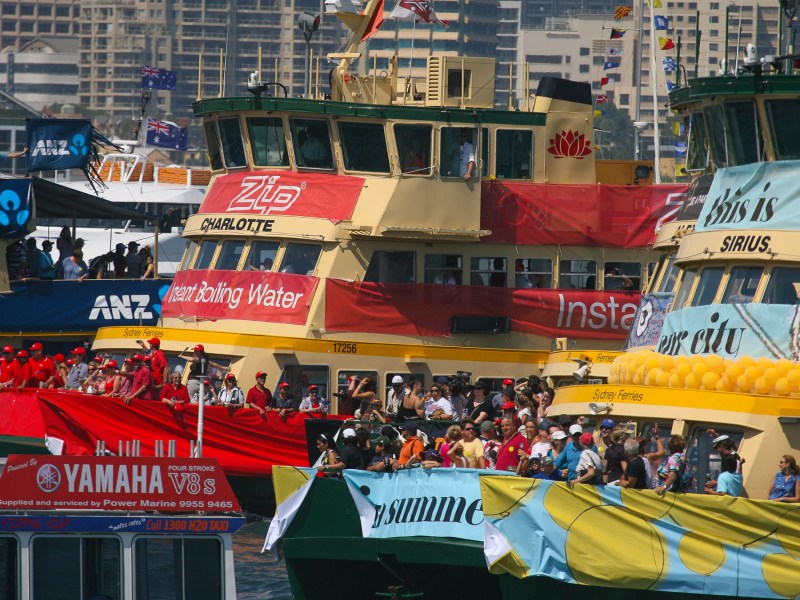 a group of people riding on the back of a boat