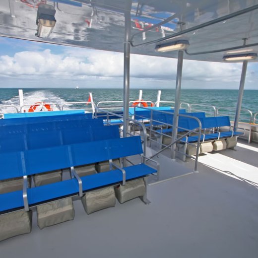 a blue boat sitting on top of a beach