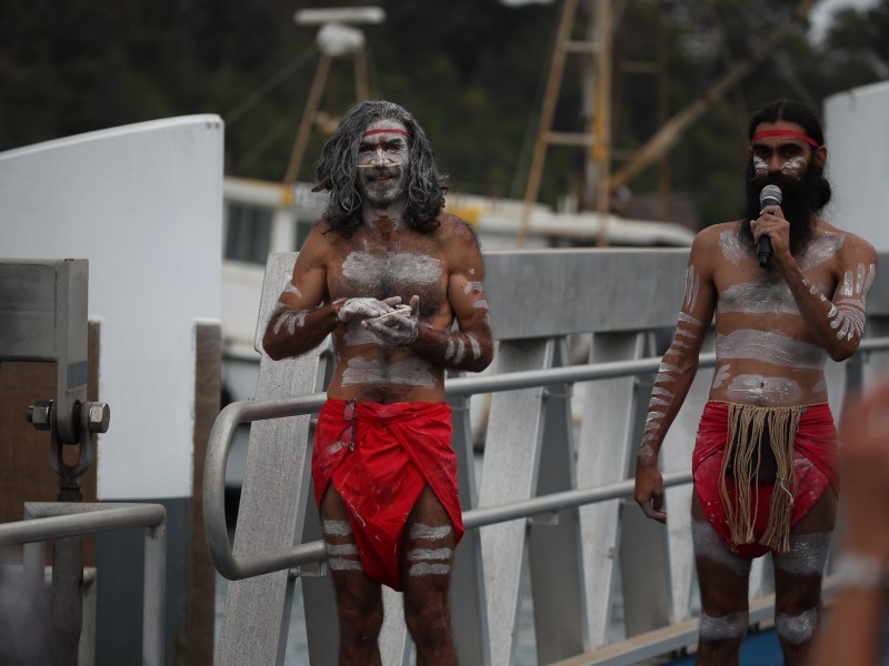 a group of people standing in front of a mirror posing for the camera