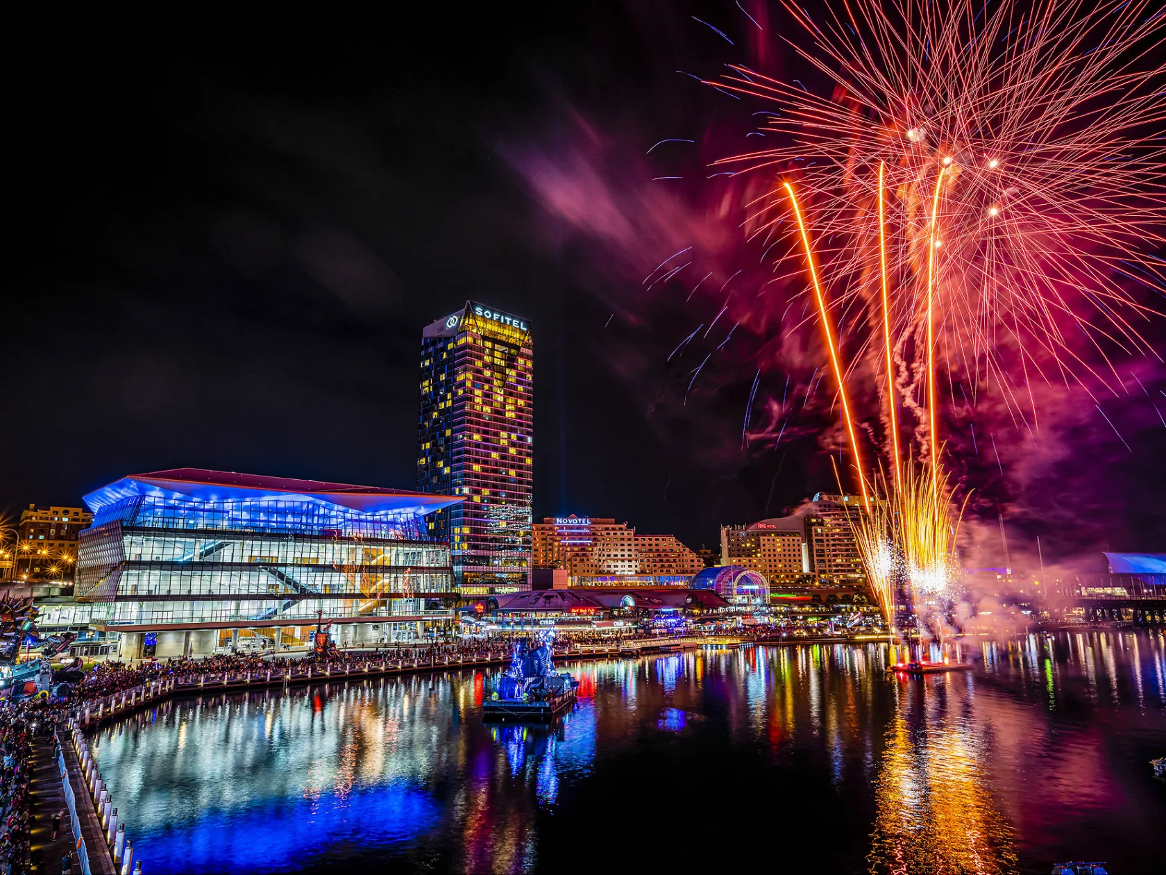 a group of fireworks in the night sky