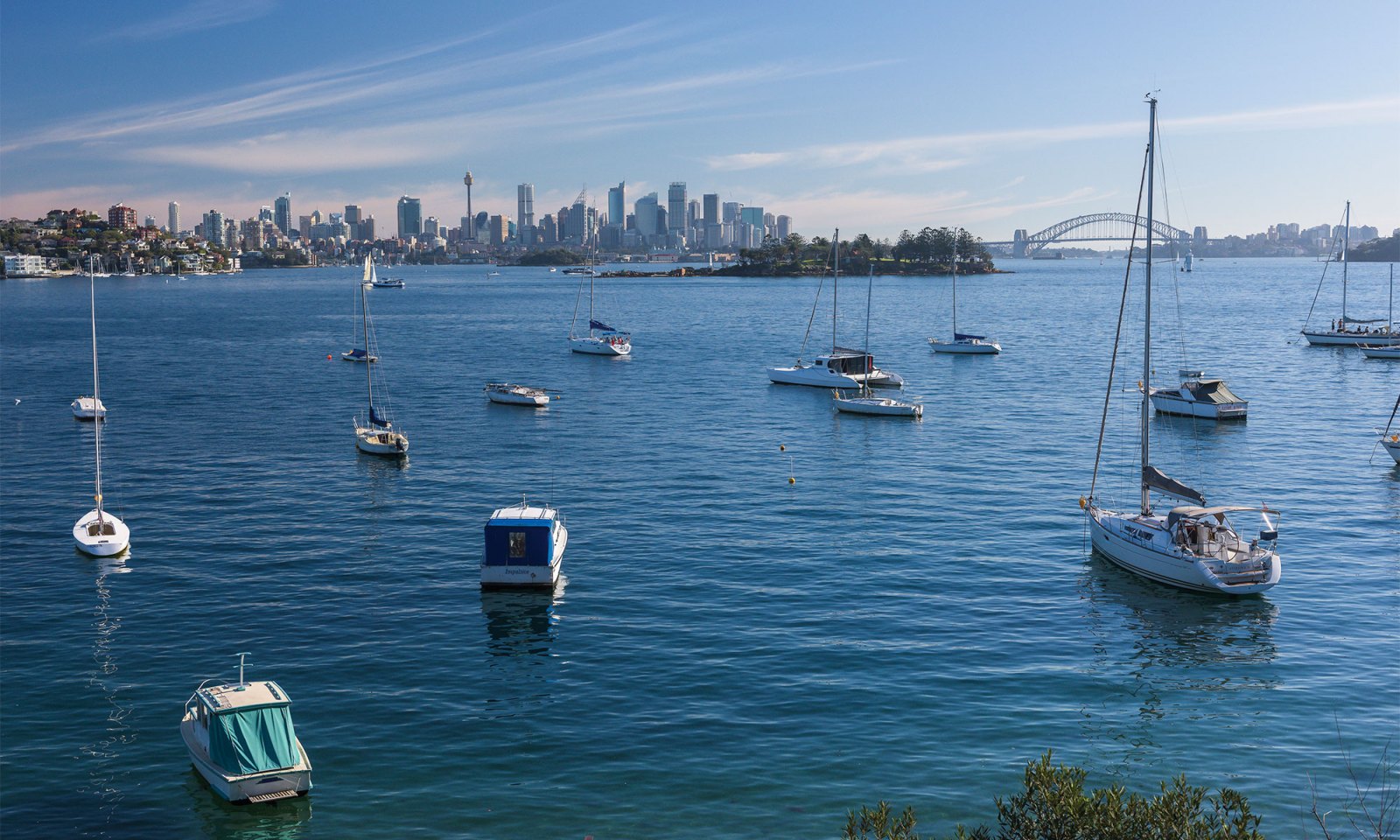 luxe_lifestyles_header a small boat in a large body of water