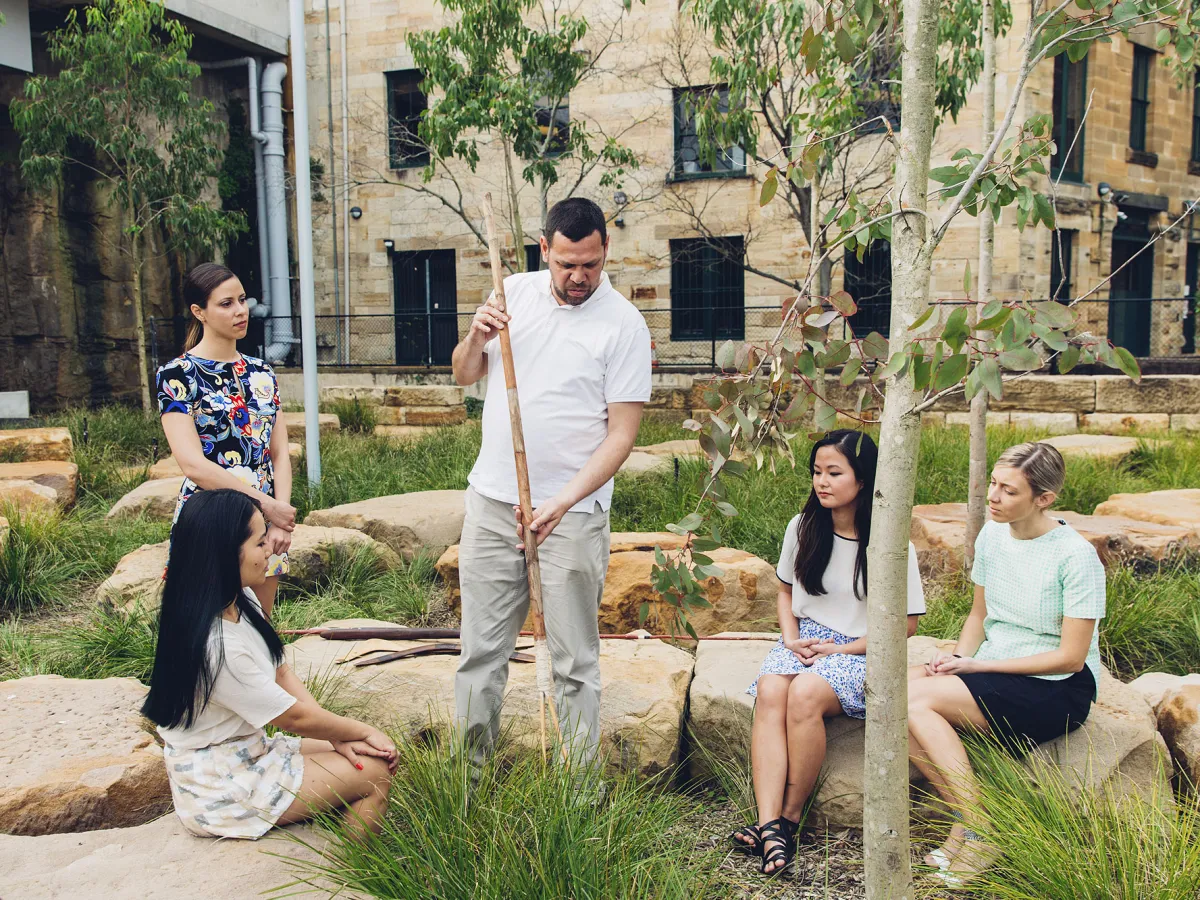 a group of people sitting at a zoo
