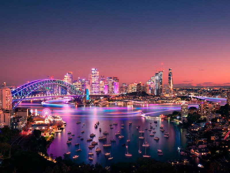 a large body of water with a city in the background
