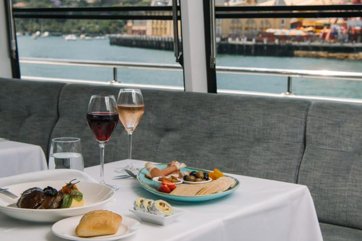 a plate of food and a glass of wine