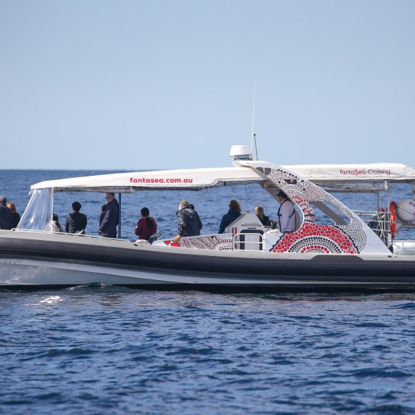 a small boat in a large body of water
