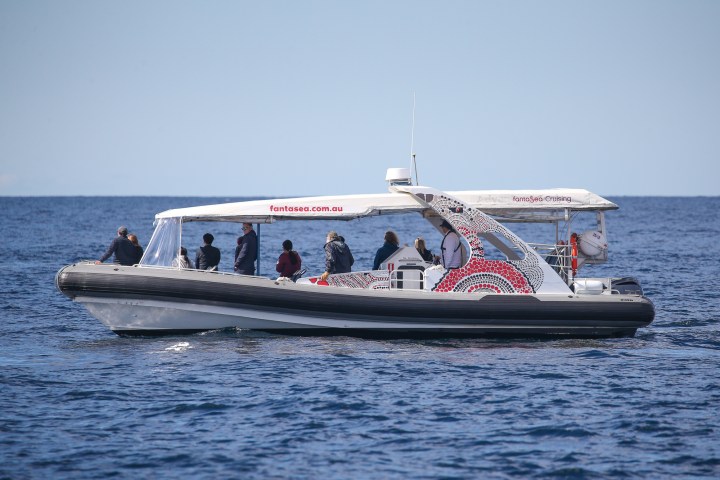 a small boat in a large body of water