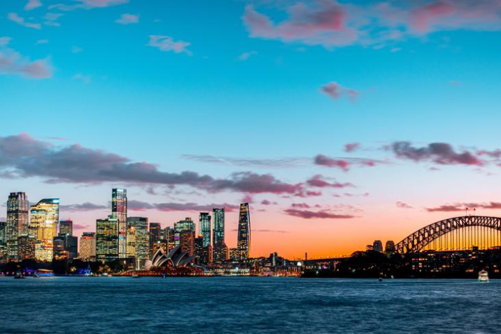 a large body of water with a city in the background