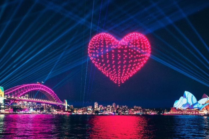 glowing heart over habrour bridgfe for VIVID lights